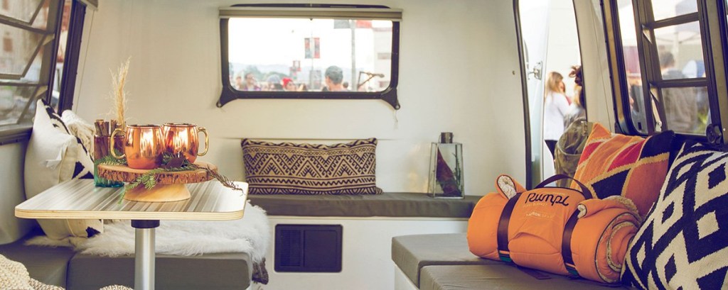 A HC! with an Adaptive interior filled with decorative pillows.