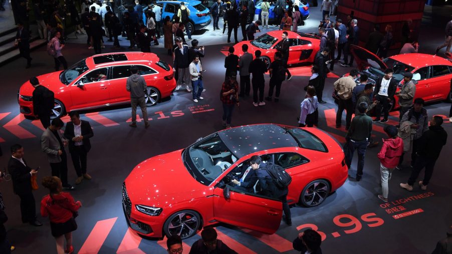 Audi cars, including the Audi RS5 (bottom) are displayed on the opening day of the Shanghai Auto Show