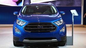 A blue Ford EcoSport on display at an auto show
