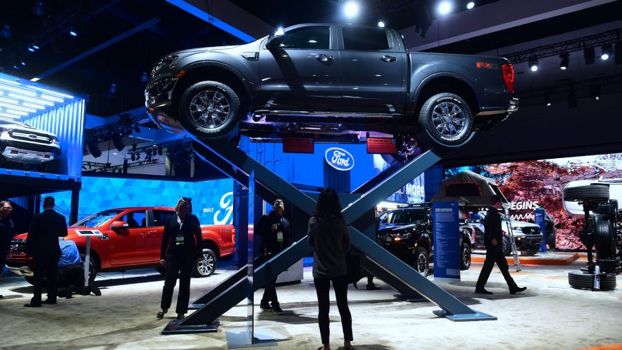 A Ford Ranger on a raised display at an auto show