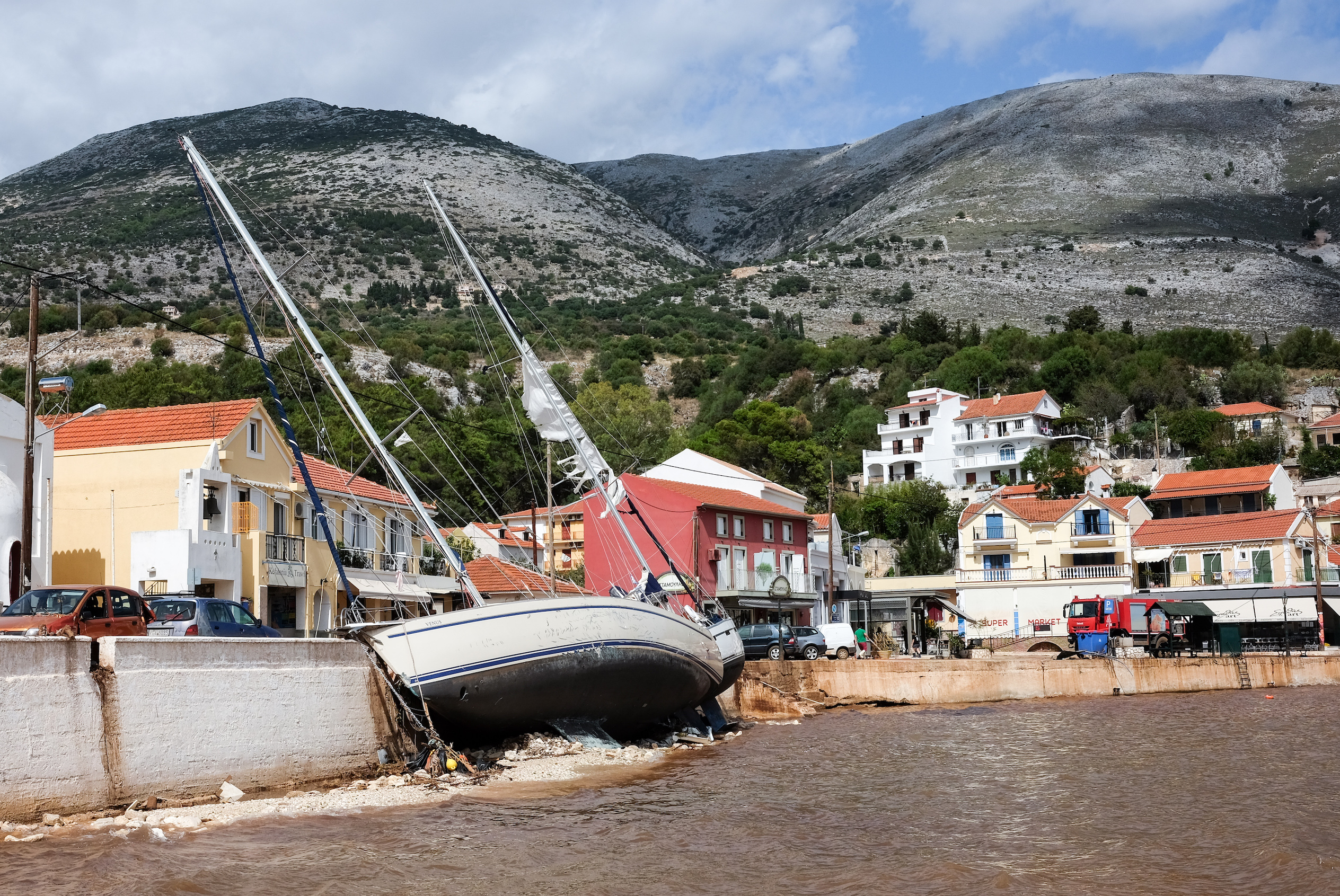 Sailing yachts are stranded in the harbour after the heavy autumn storm "Ianos" at the quay wall. The so-called Medicane, a Mediterranean hurricane, and another storm over the North Aegean Sea caused severe damage and destruction