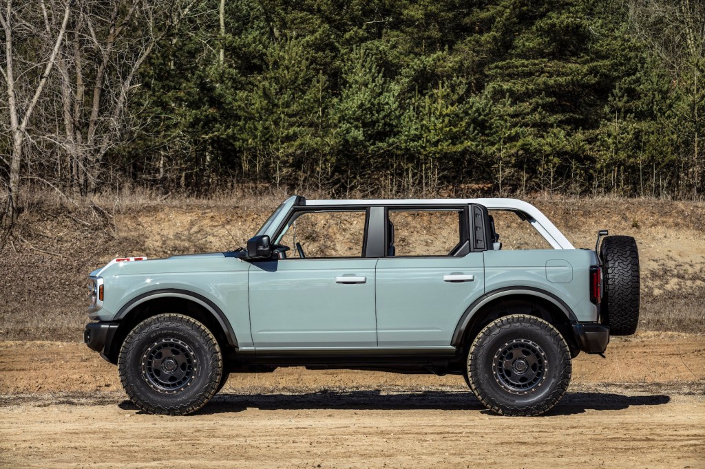 A photo of the Ford Bronco outdoors with its tops off.