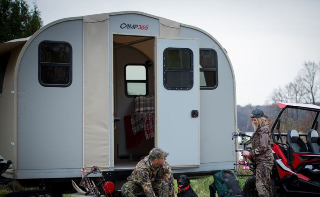 The Camp 365 transforming RV trailer is unfolded and set up as a cabin.