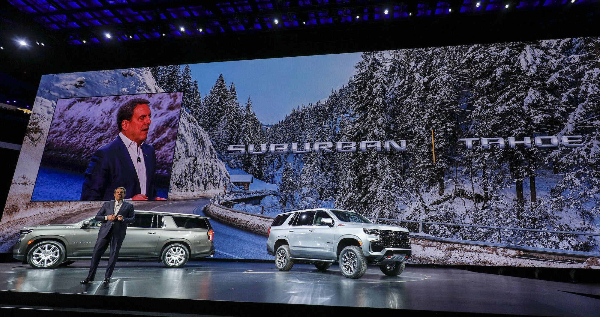 The new 2021 Chevrolet Suburban (left) and 2021 Tahoe (right) SUVs at their reveal at Little Caesars Arena