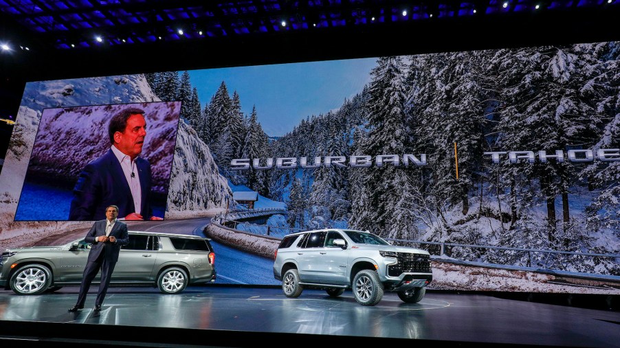 The new 2021 Chevrolet Suburban (left) and 2021 Tahoe (right) SUVs at their reveal at Little Caesars Arena
