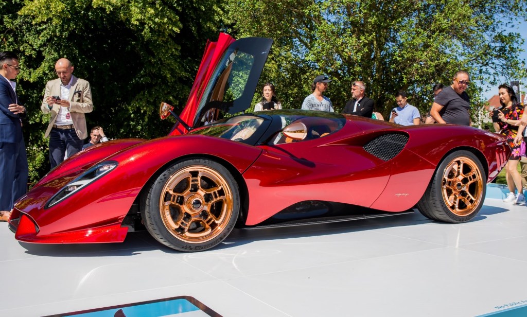 A red De Tomaso P72 sits on display