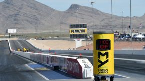A drag strip stands ready for action against a mountain backdrop.