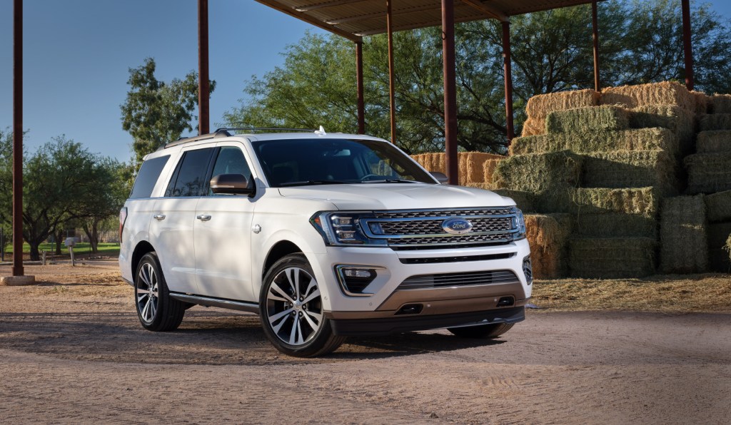 A 2020 Ford Expedition parked in front of a haystack