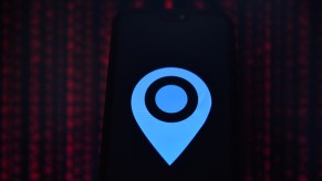 In this photo illustration a GPS logo seen displayed on a smartphone for potential use on a boat