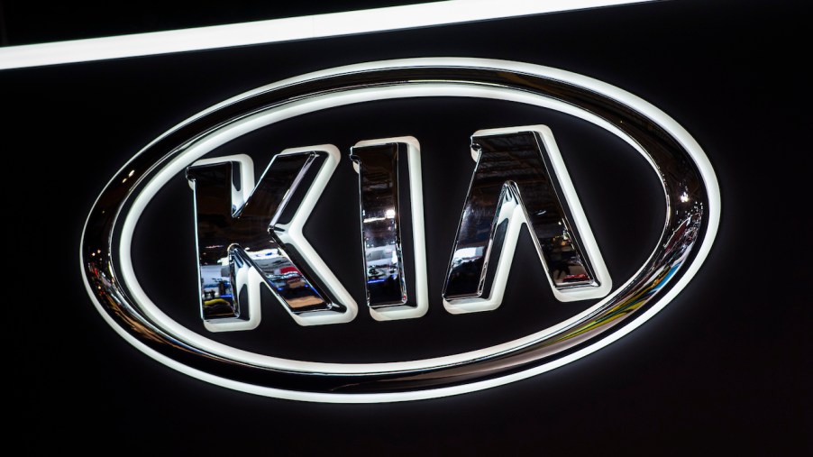A close up image of the Kia logo.