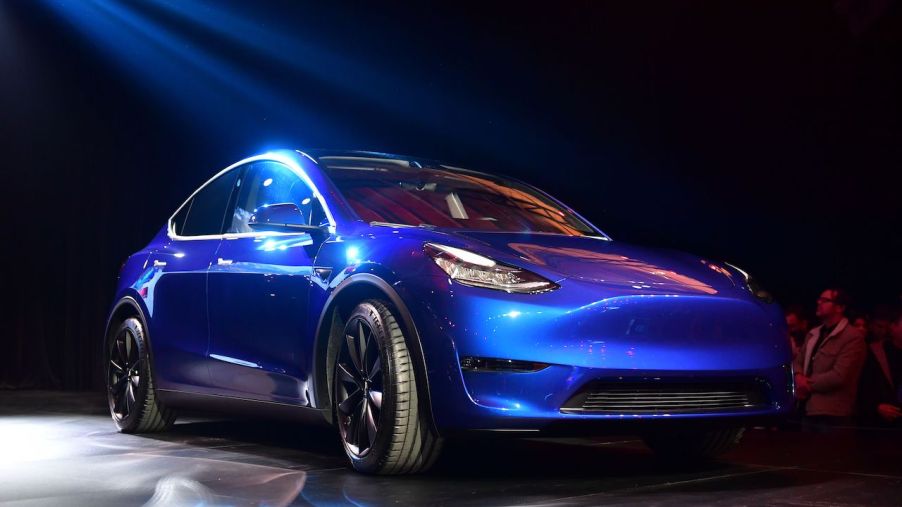 An image of a Tesla Model Y on a stage.