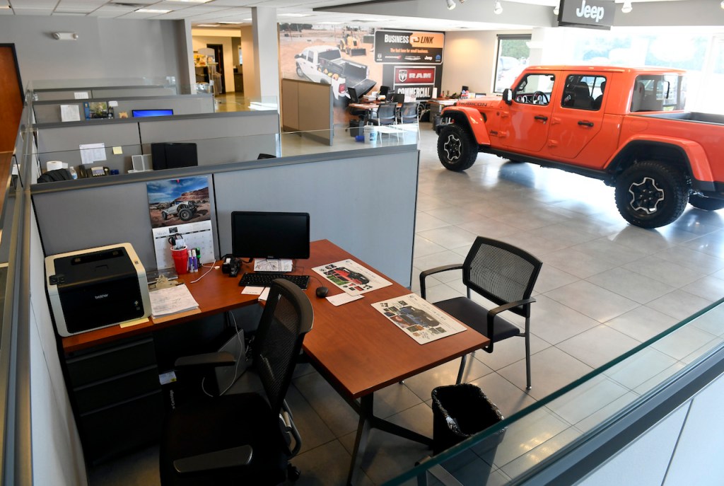 A photo of the interior of a car dealership.