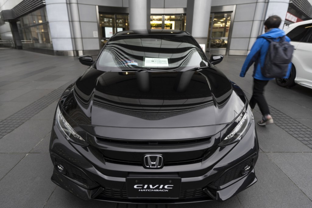 A black Honda Civic hatchback on display