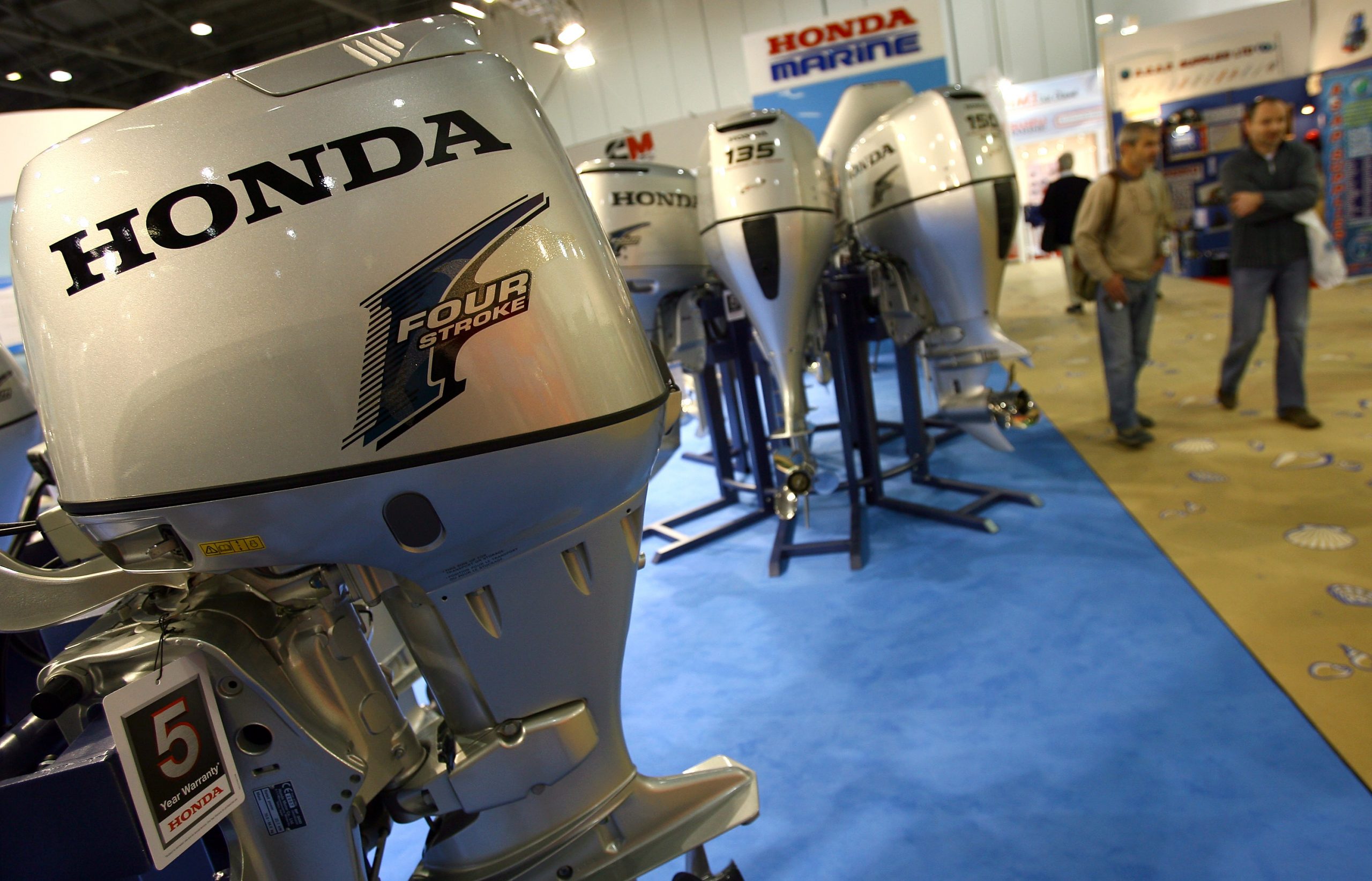 Honda outboard motors on display at a boat show