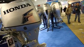 Honda outboard motors on display at a boat show