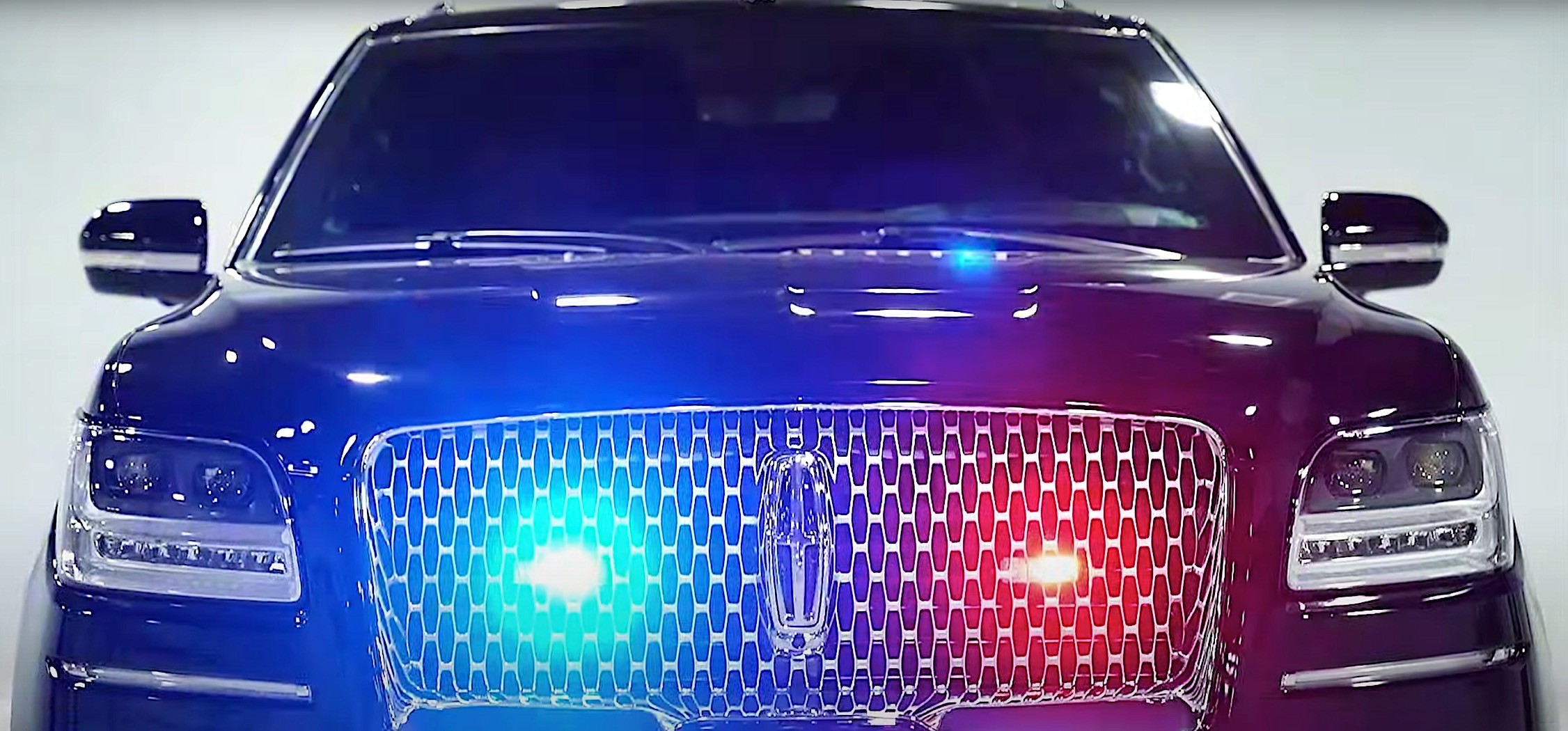 A head-on view of a black, armored 2020 Lincoln Navigator L from Inkas Armored Vehicle Manufacturing