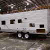 Workers at Jayco, Inc., the country's third largest maker of recreational vehicles, construct Jay Flight travel trailers