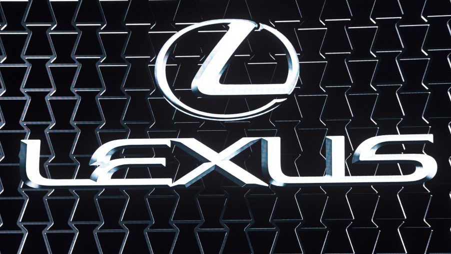 The Lexus logo on display at an auto show