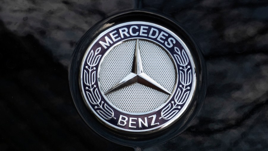 Mercedes logo seen on the hood of a black car.