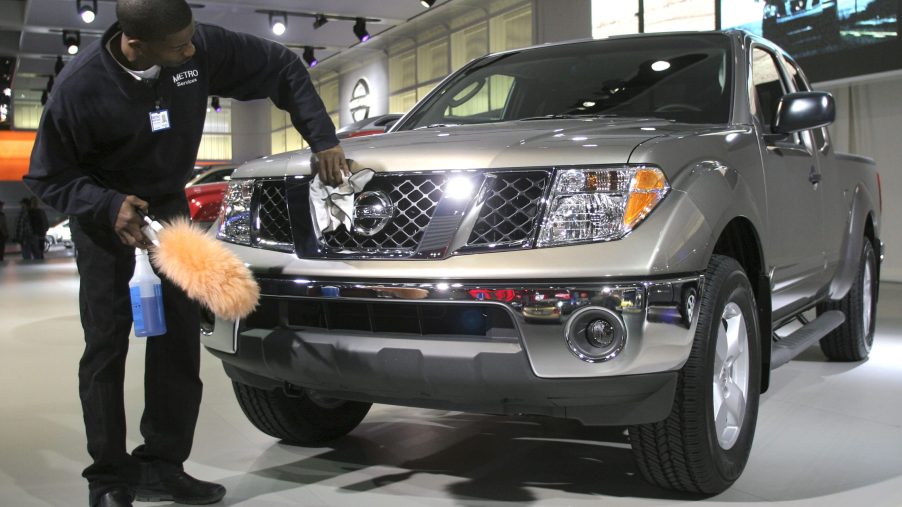 A man polishes a Nissan Frontier