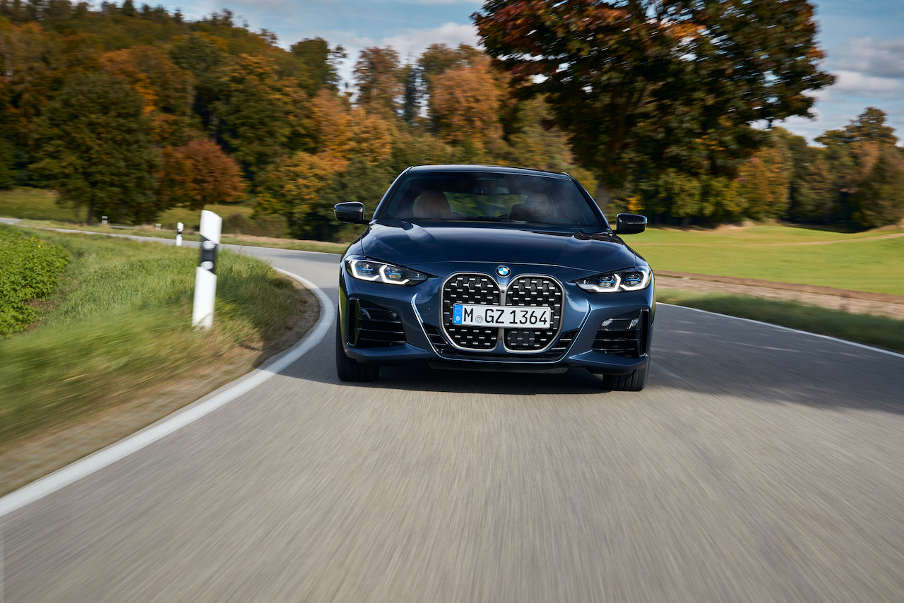 An image of the BMW 440i xDrive on the road.