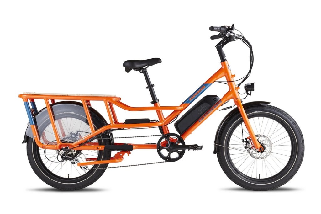 The side view of an orange Rad Power RadWagon4 e-cargo-bike