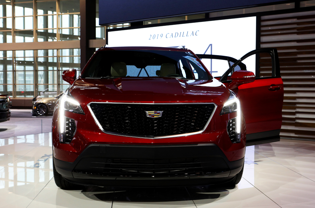 A red Cadillac XT4 on display at an auto show