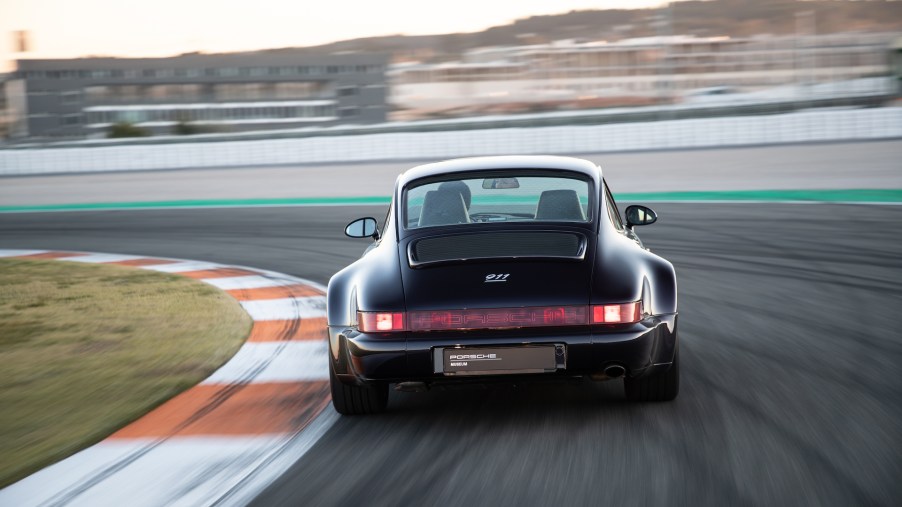 A photo of a vintage Porsche 911 on track.