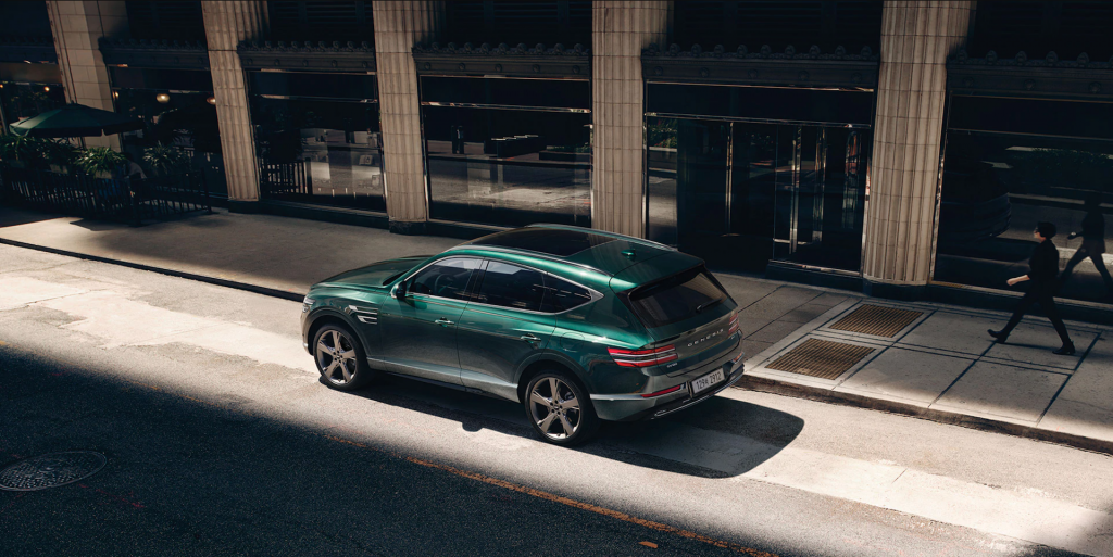 A photo of the Genesis GV80 on the road.