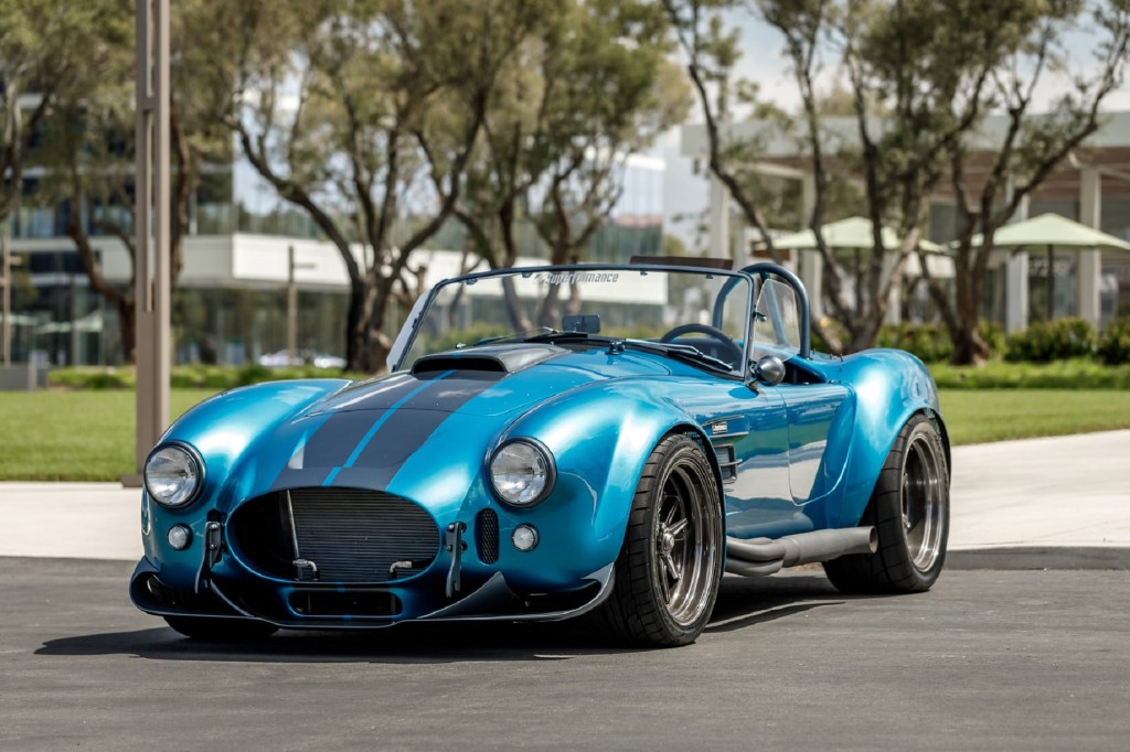 A turquoise Superformance MKIII-R Shelby Cobra replica kit car