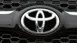 A Toyota logo seen on the front of an SUV