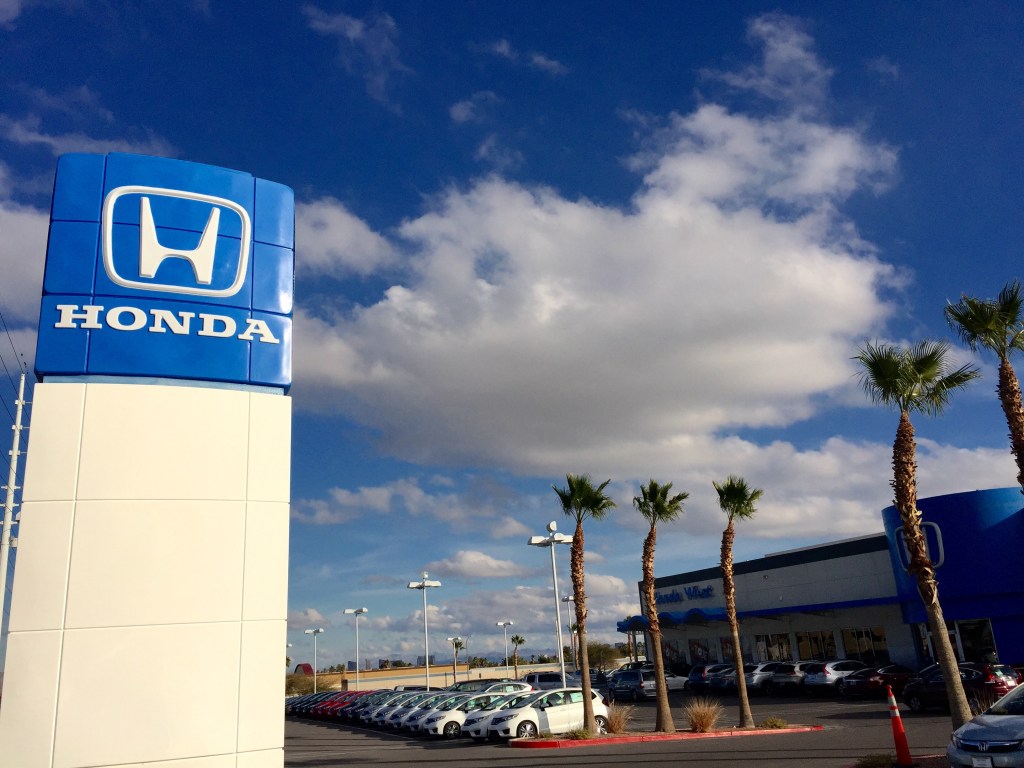 A used Honda car dealership with cars on display