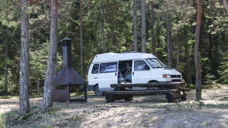 A camper van parked at a camp site