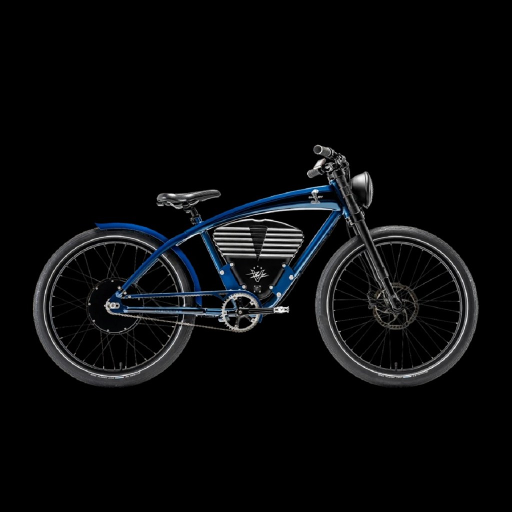 A blue Vintage Electric Shelby e-bike with the Shelby snake logo