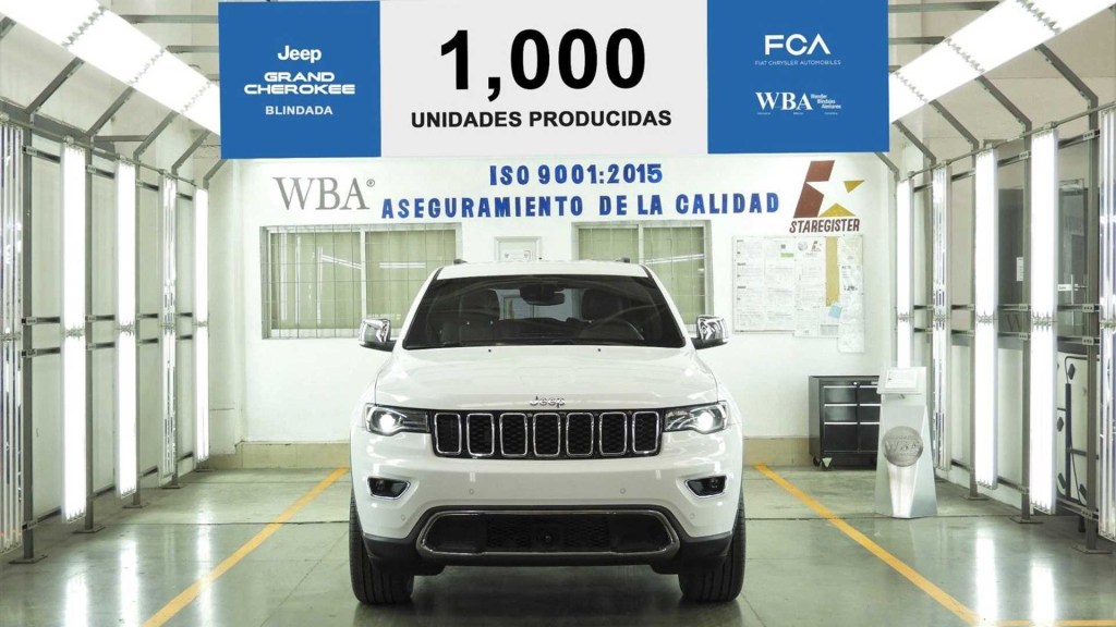 The 1,000th completed armored Jeep Grand Cherokee sits on a factory floor.