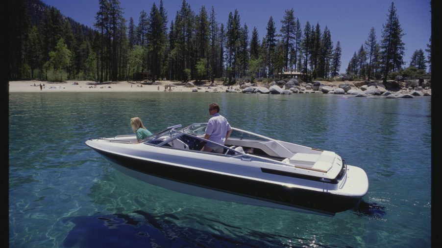 A Bayliner Maxum boat on crystal clear water.