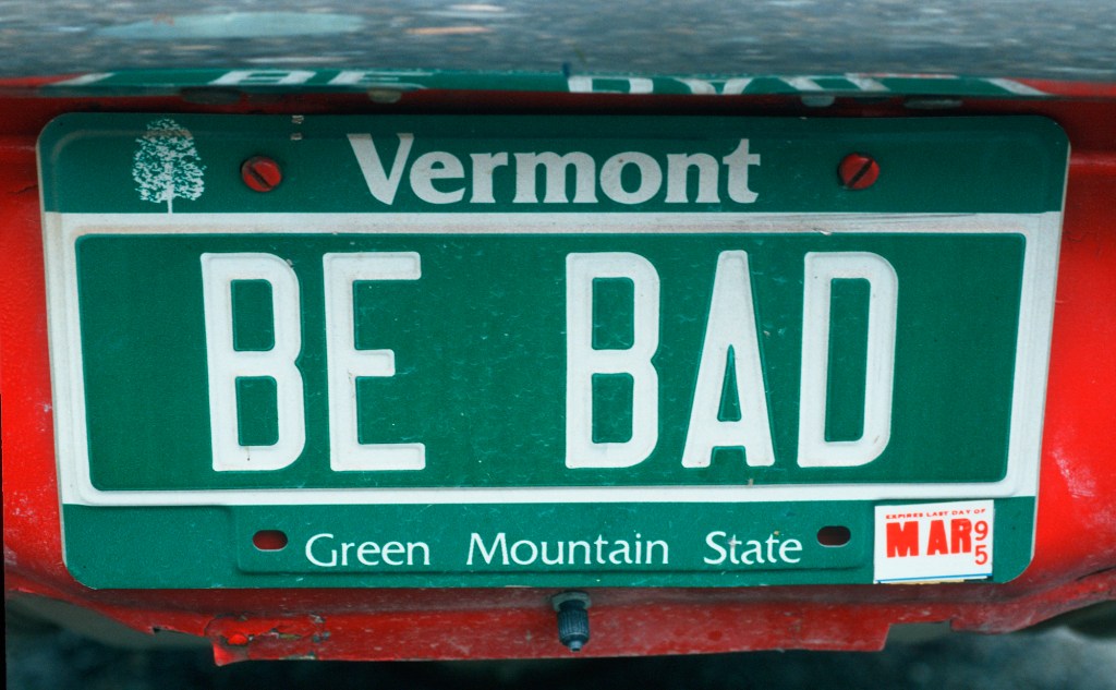 A vermont license plate that says "be bad"