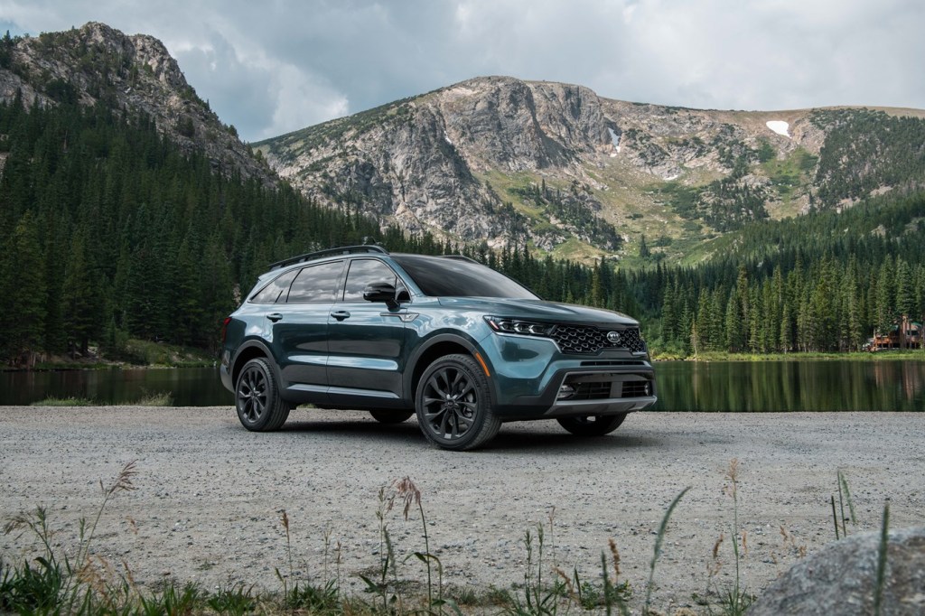 a 2021 X-line package dressed for rugged adventure parked by a lake in the mountains