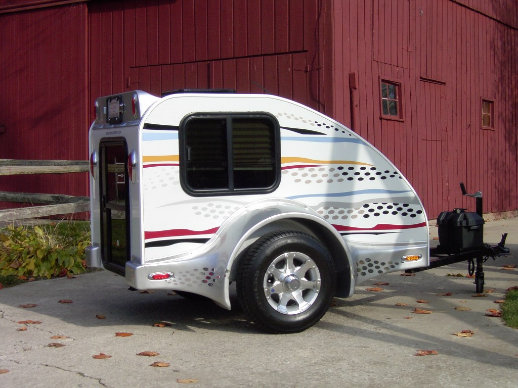 A white Easy Rider motorcycle camper RV trailer for motorcycles
