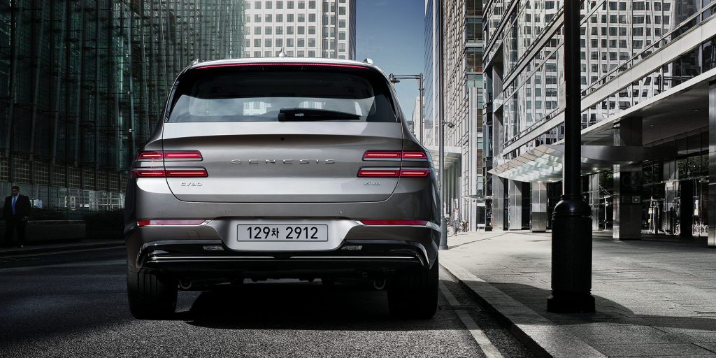 A photo of the Genesis GV80 on the road.