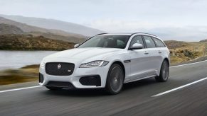 An image of a Jaguar XF driving down the road.