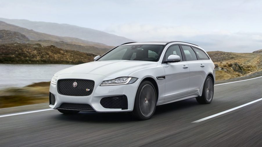 An image of a Jaguar XF driving down the road.