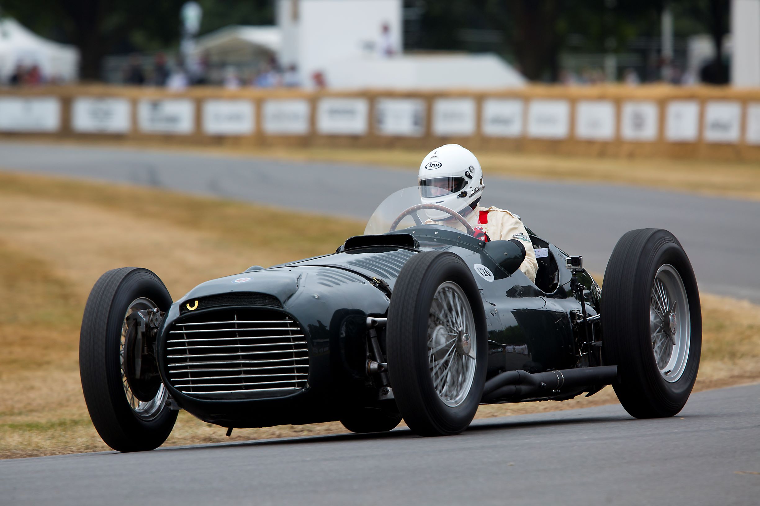 A black 1950 BRM Type 15 driven at Goodwood by Doug Hill