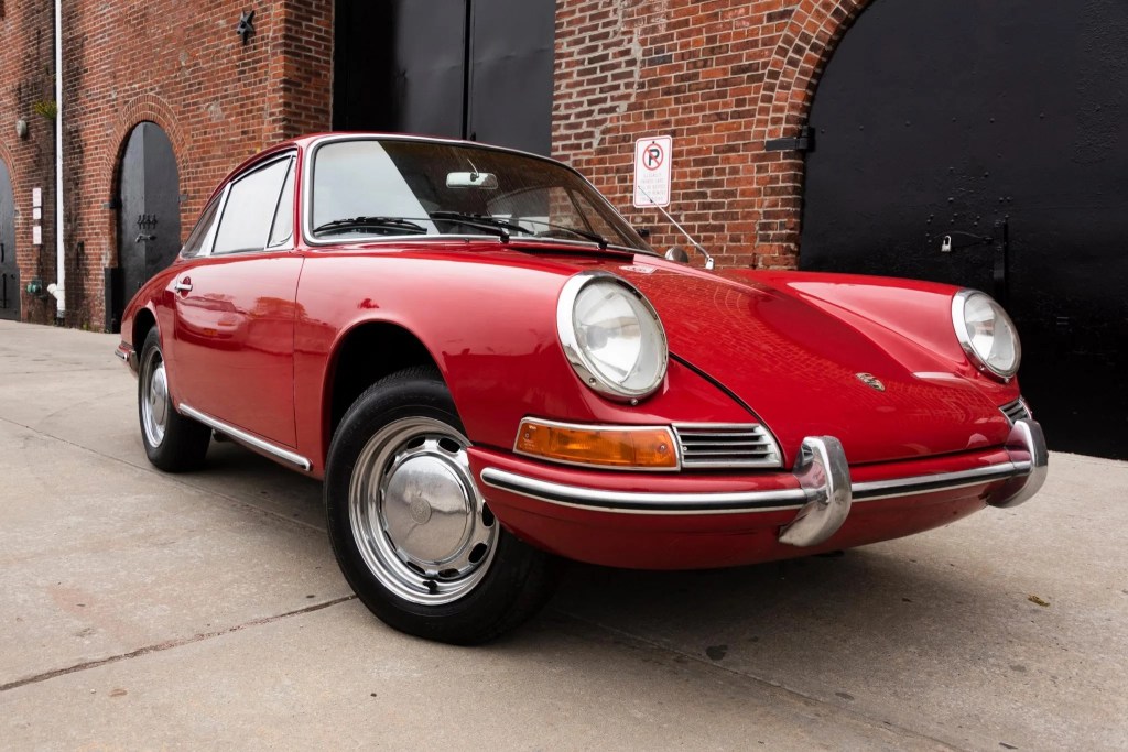 The front 3/4 of a red 1966 Porsche 912