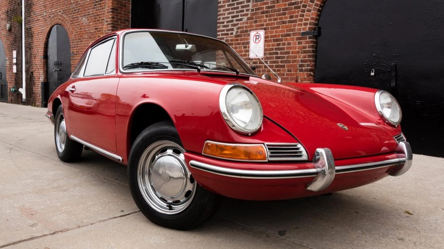 The front 3/4 of a red 1966 Porsche 912