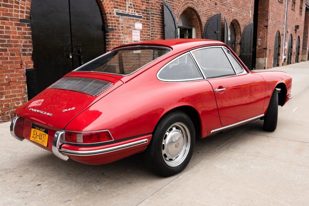 The rear 3/4 view of a red 1966 Porsche 912