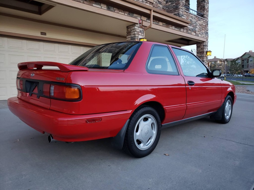 The rear 3/4 view of a red 1991 Nissan Sentra SE-R