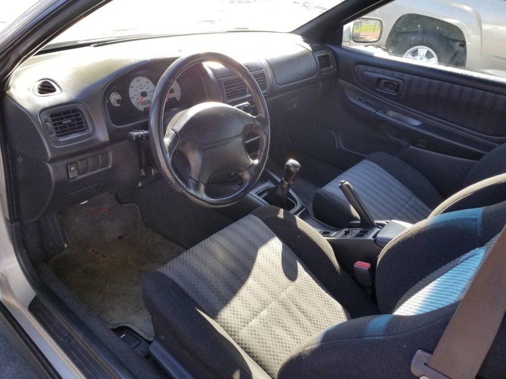 The 1999 Subaru Impreza 2.5RS' front seats and dashboard