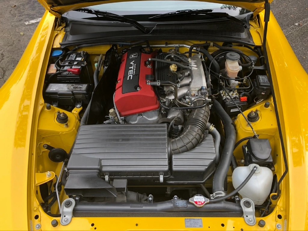 The red-covered 2002 Honda S2000's engine