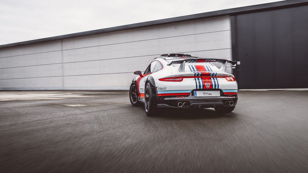 The rear view of the white-red-and-blue 2012 Porsche 911 Vision Safari